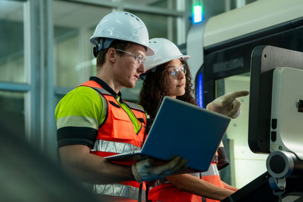 Engineers collaborating on warehouse automation technology