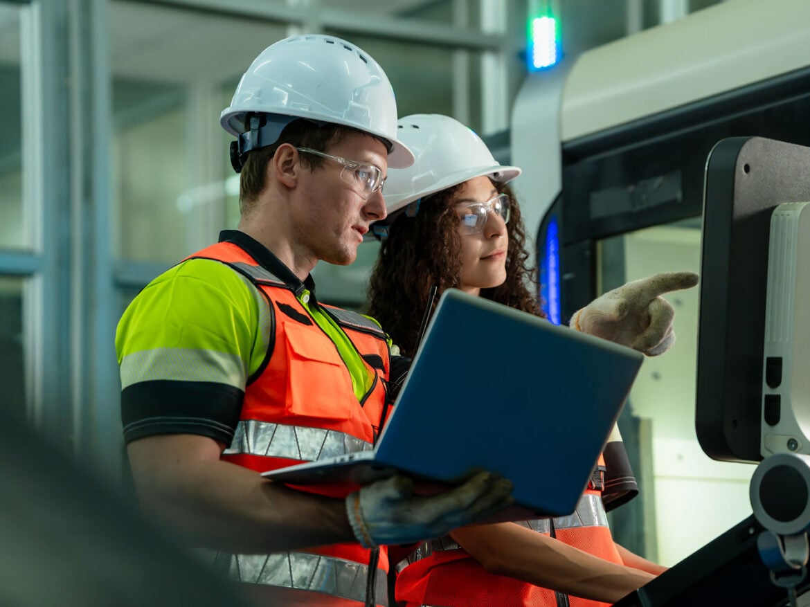 Engineers collaborating on warehouse automation technology