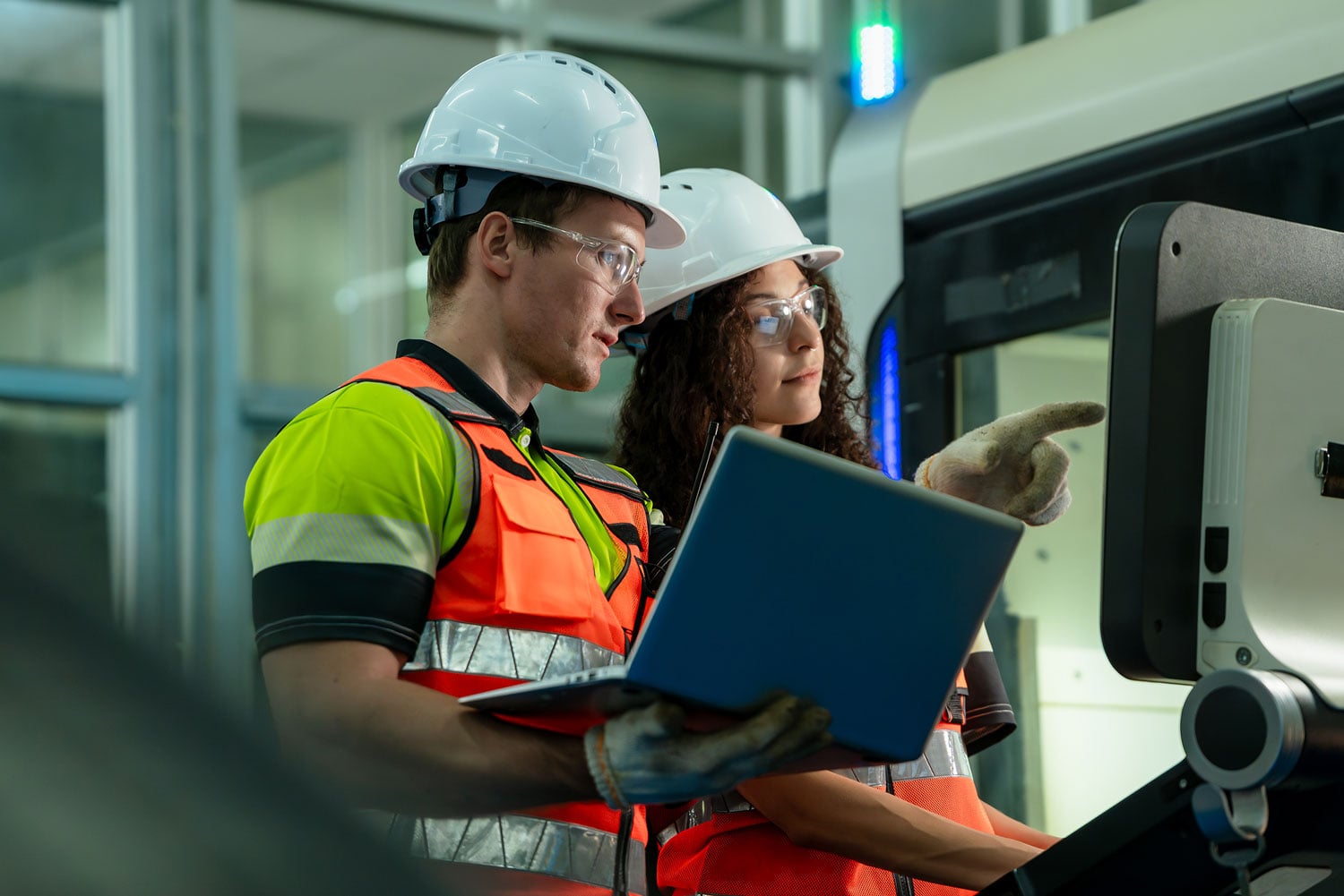 Engineers collaborating on warehouse automation technology